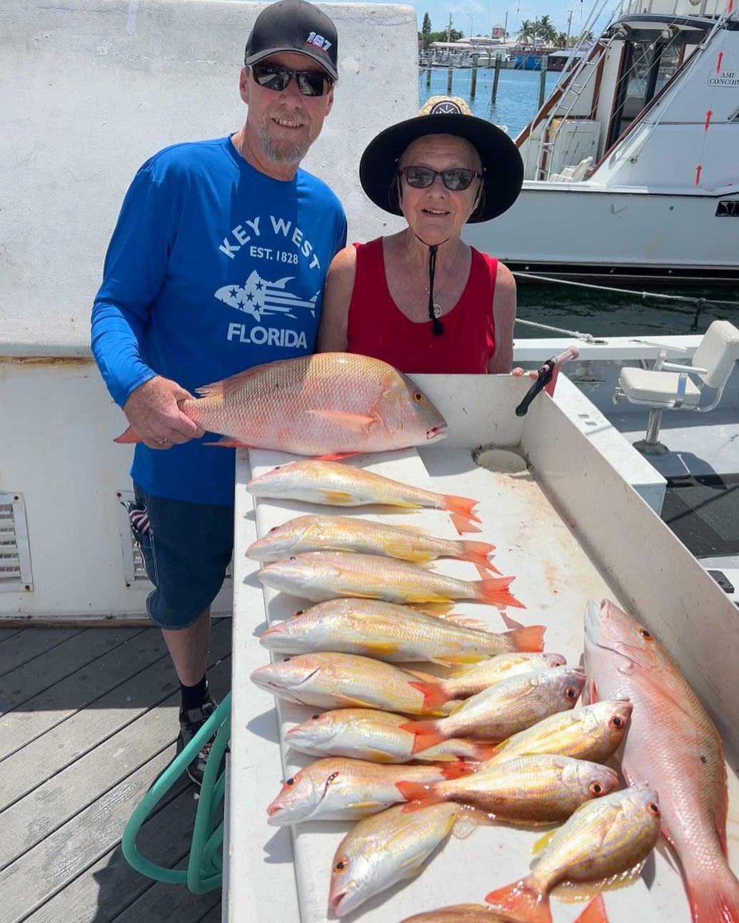 Guests with a snapper bottom fishing catch