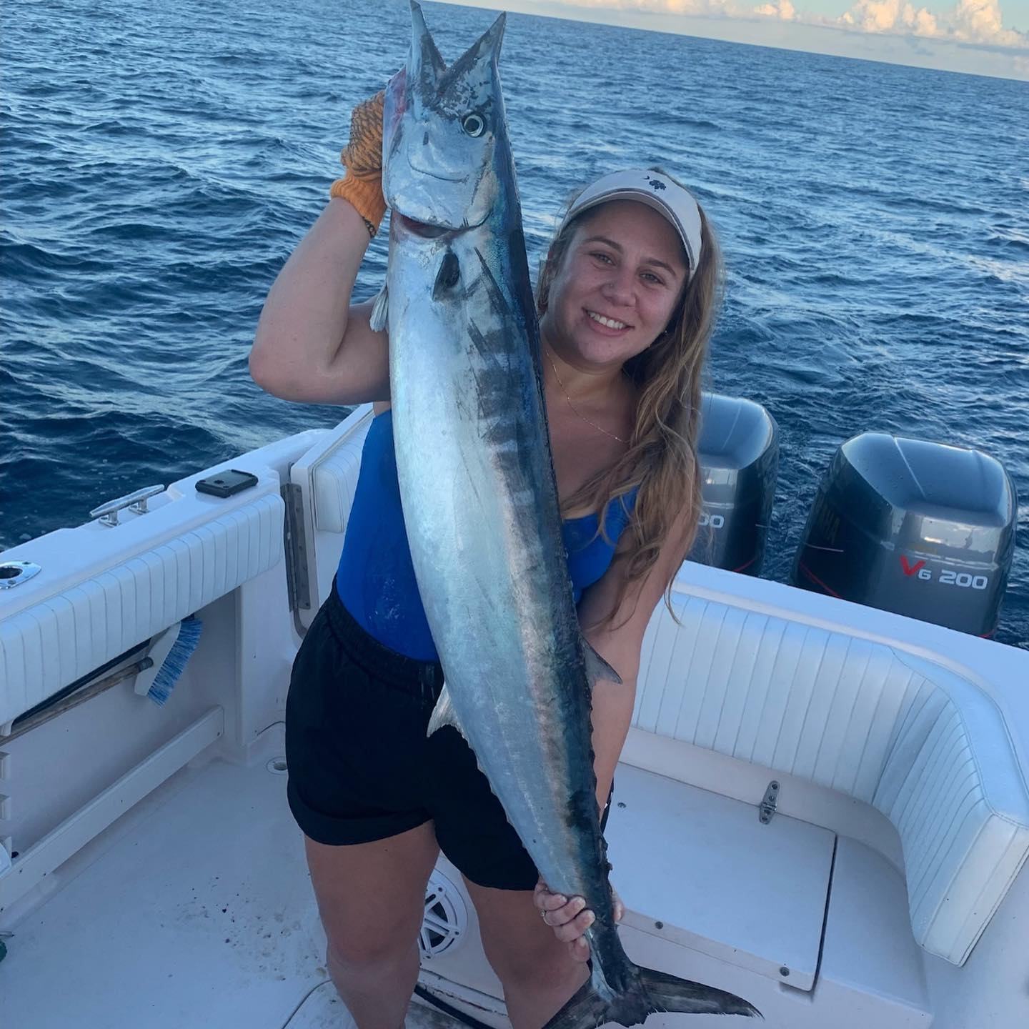 Woman holding wahoo catch