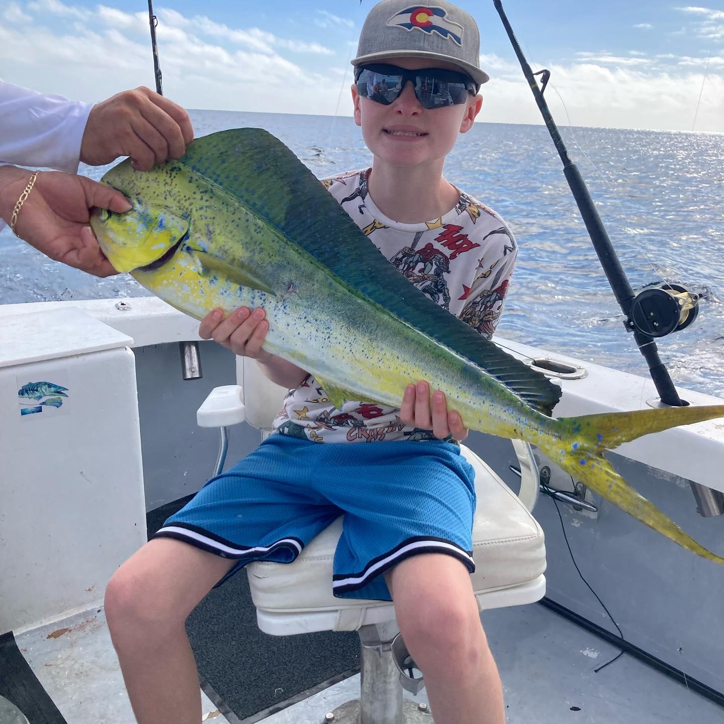 Kid with mahi-mahi catch