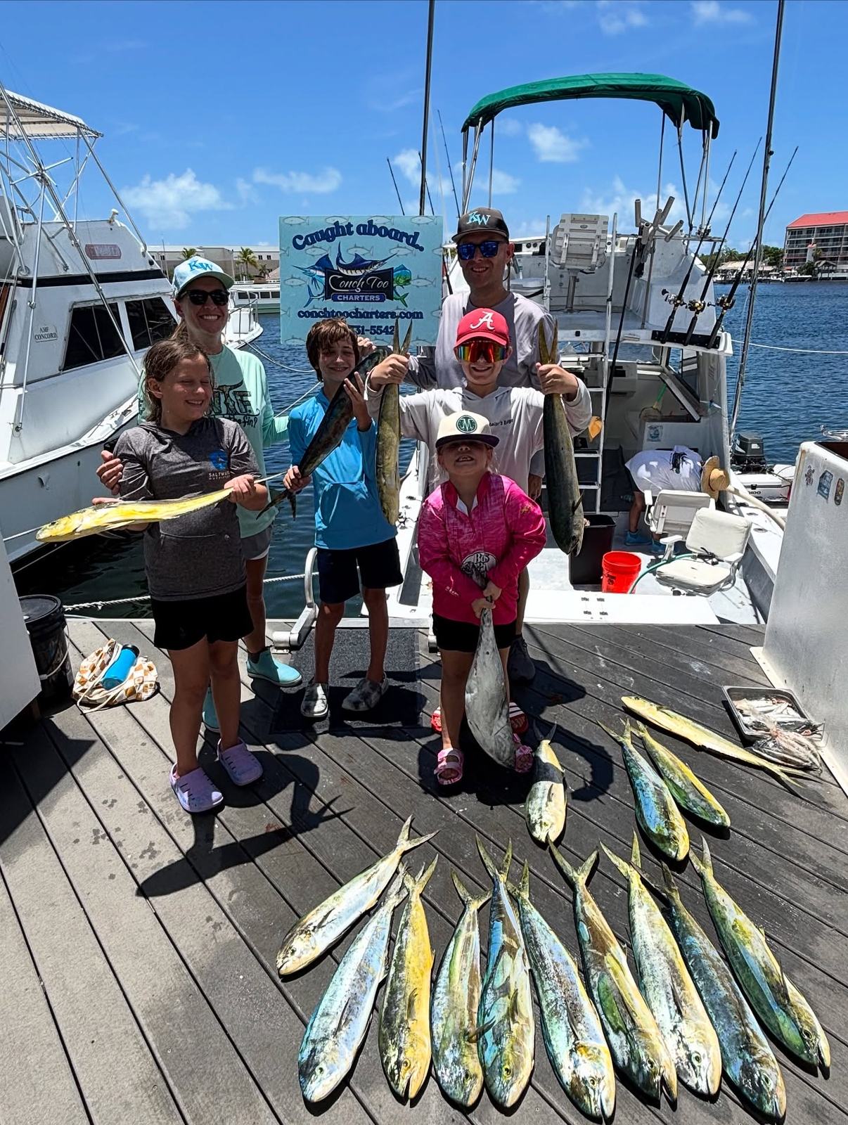 Family with mahi mahi catch